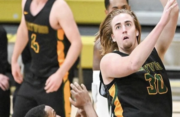 A Marywood basketball player shooting a hook shot.